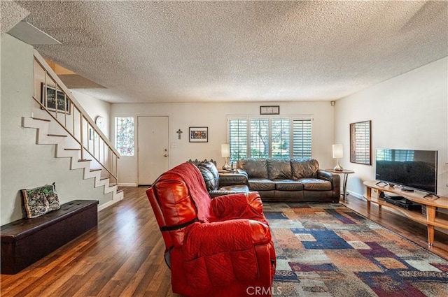 9739 Reseda Blvd Unit 36, Northridge, CA 91324 - living area featuring wood finished floors, a textured ceiling, and stairway