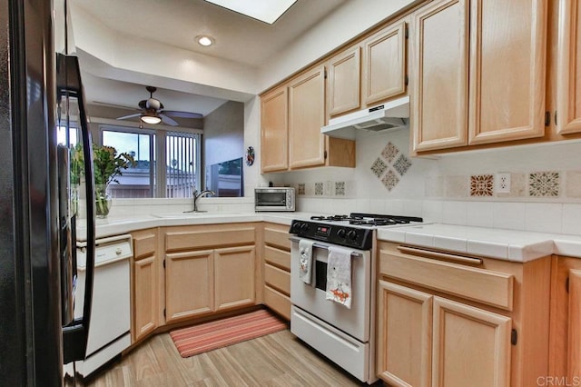 11368 Via Rancho San Diego Unit C, El Cajon, CA 92019 - kitchen featuring white appliances, light brown cabinets, under cabinet range hood, and recessed lighting