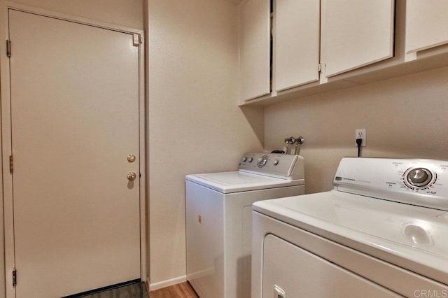 11368 Via Rancho San Diego Unit C, El Cajon, CA 92019 - laundry area with washing machine and clothes dryer, cabinet space, and light wood-style flooring