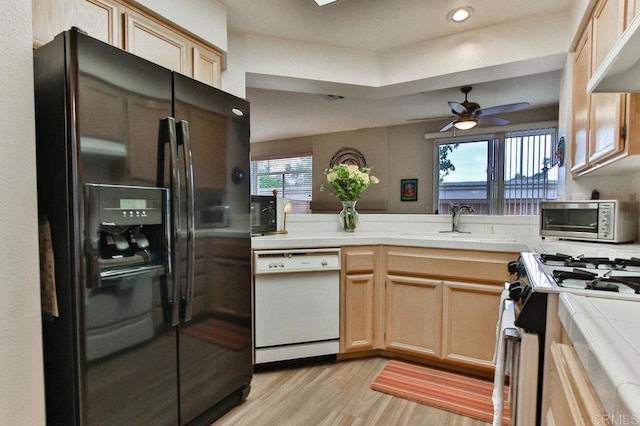 11368 Via Rancho San Diego Unit C, El Cajon, CA 92019 - kitchen with black fridge with ice dispenser, dishwasher, tile countertops, light wood-style flooring, and recessed lighting