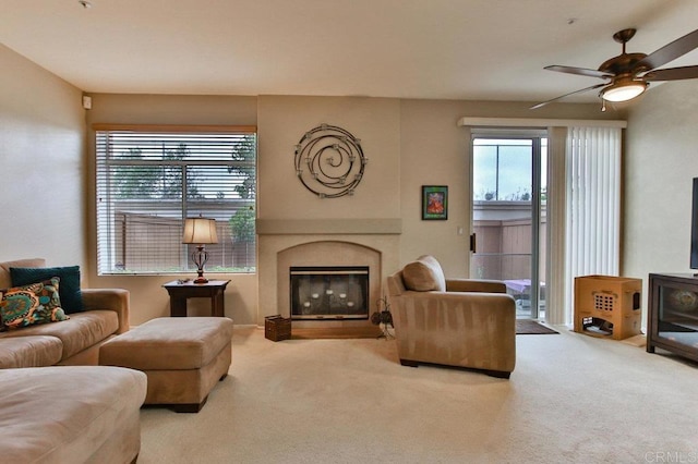 11368 Via Rancho San Diego Unit C, El Cajon, CA 92019 - living area with carpet, a ceiling fan, and a glass covered fireplace