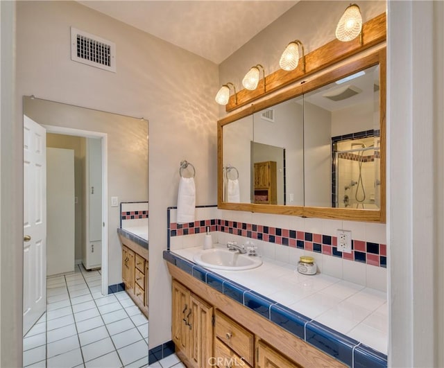 430 N Canyon Blvd, Monrovia, CA 91016 - bathroom featuring vanity, tile patterned flooring, and tasteful backsplash