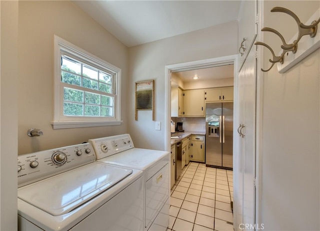 430 N Canyon Blvd, Monrovia, CA 91016 - washroom with washing machine and dryer and light tile patterned floors