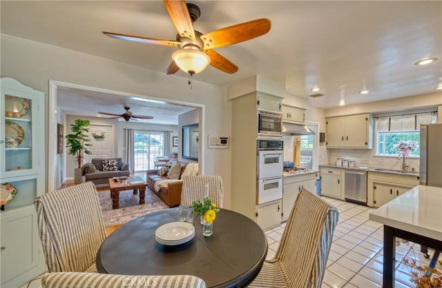 430 N Canyon Blvd, Monrovia, CA 91016 - dining space with healthy amount of natural light, a ceiling fan, light tile patterned floors, and recessed lighting