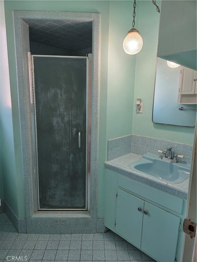 11505 Elmhurst Dr, Norwalk, CA 90650 - bathroom featuring vanity, a stall shower, and tile patterned flooring