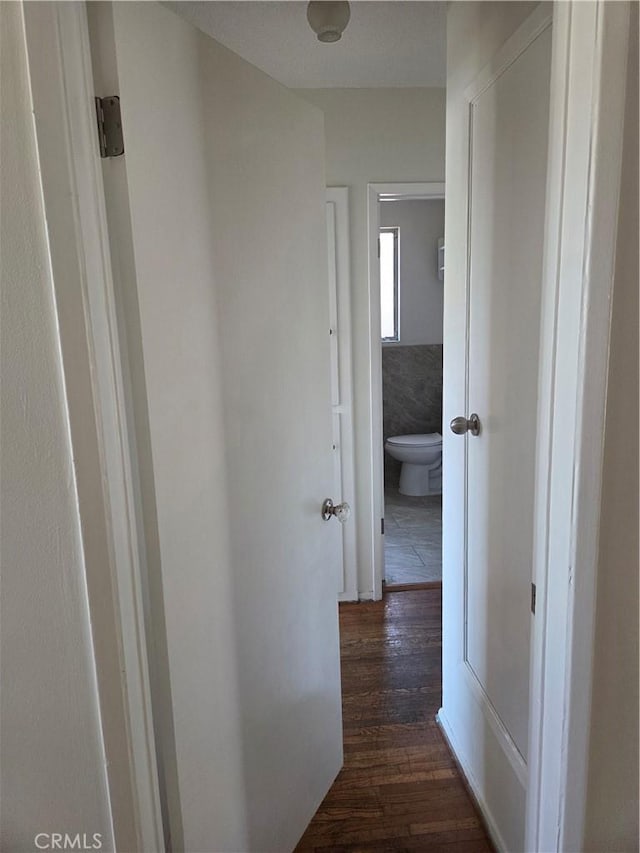 11505 Elmhurst Dr, Norwalk, CA 90650 - hallway featuring dark wood-type flooring