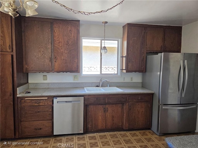 11505 Elmhurst Dr, Norwalk, CA 90650 - kitchen featuring appliances with stainless steel finishes, light countertops, and hanging light fixtures