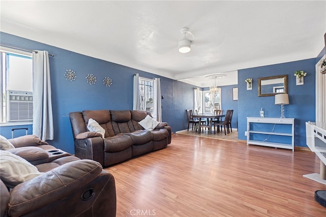 1445 W 155th St, Compton, CA 90220 - living room with ceiling fan, wood finished floors, a chandelier, and cooling unit