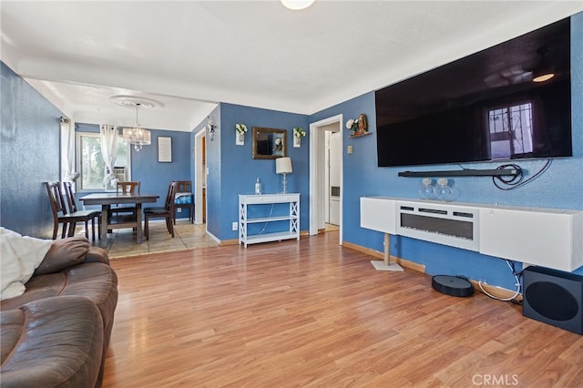 1445 W 155th St, Compton, CA 90220 - living area with a chandelier and wood finished floors
