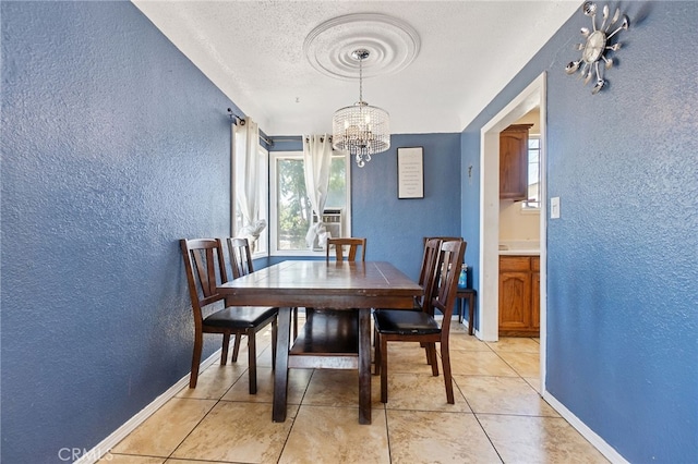 1445 W 155th St, Compton, CA 90220 - dining room with a textured wall, a chandelier, a textured ceiling, and light tile patterned floors