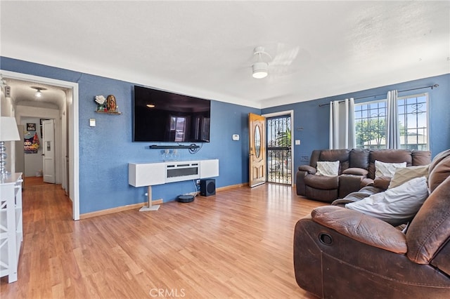 1445 W 155th St, Compton, CA 90220 - living area with wood finished floors and ceiling fan
