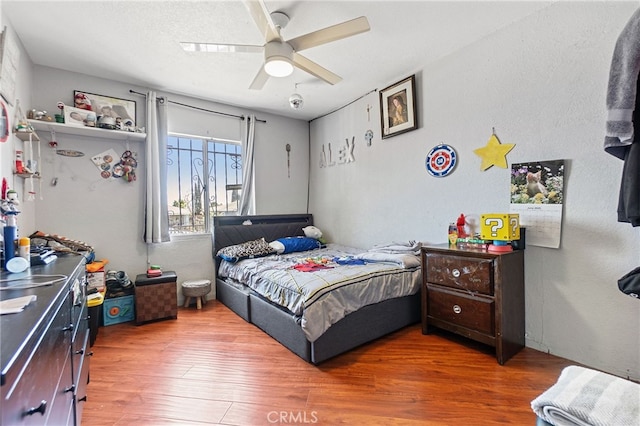 1445 W 155th St, Compton, CA 90220 - bedroom with wood finished floors and a ceiling fan