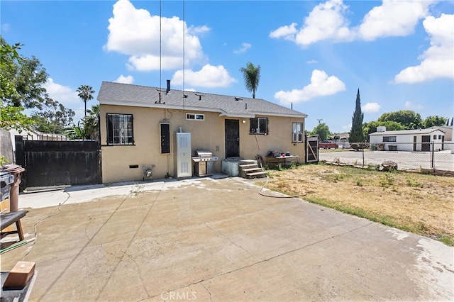 1445 W 155th St, Compton, CA 90220 - rear view of house featuring stucco siding and a patio area