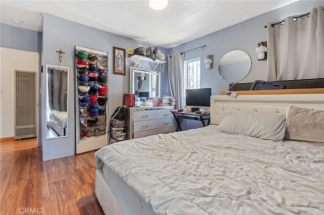 1445 W 155th St, Compton, CA 90220 - bedroom featuring a heating unit and wood finished floors