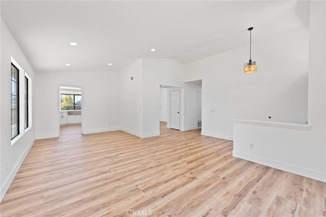 18085 Golden Leaf Ln, Riverside, CA 92504 - unfurnished living room featuring vaulted ceiling, light wood-style flooring, and recessed lighting