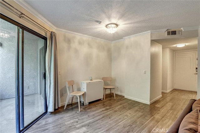 550 Orange Ave Unit 212, Long Beach, CA 90802 - living room with wood finished floors, ornamental molding, and a textured ceiling