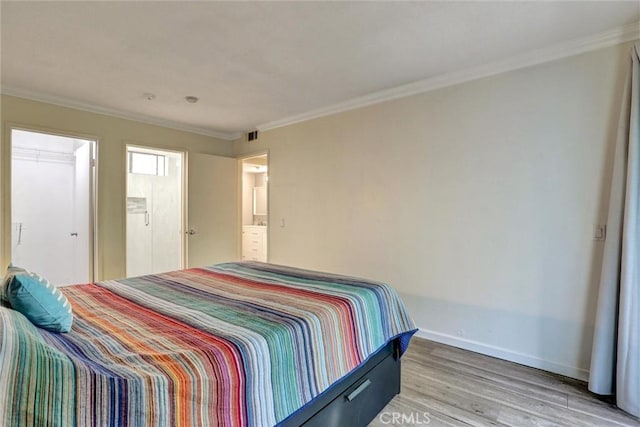 550 Orange Ave Unit 212, Long Beach, CA 90802 - bedroom featuring light wood-style flooring and crown molding