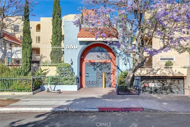 550 Orange Ave Unit 212, Long Beach, CA 90802 - view of property featuring a garage