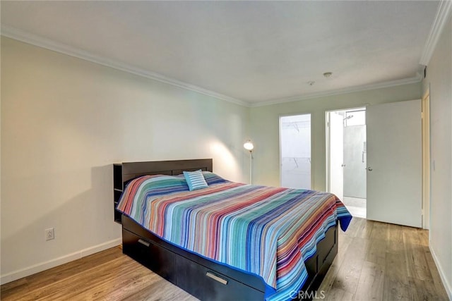 550 Orange Ave Unit 212, Long Beach, CA 90802 - bedroom with wood finished floors and crown molding