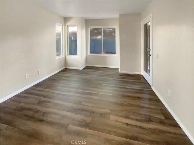 1564 Tanglewood Ln Unit 11, Escondido, CA 92029 - spare room with dark wood finished floors
