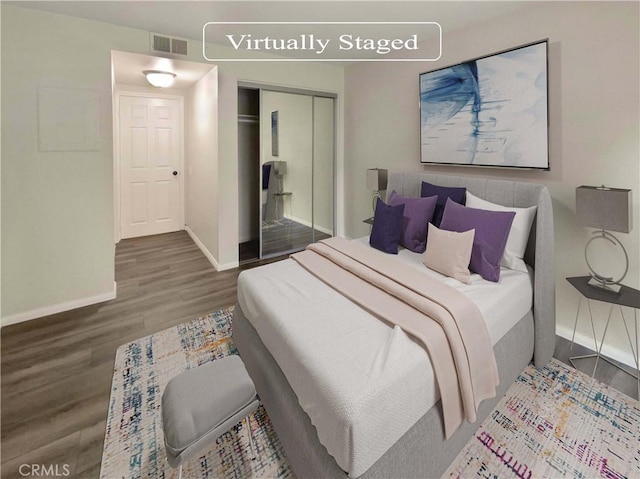 1564 Tanglewood Ln Unit 11, Escondido, CA 92029 - bedroom featuring wood finished floors and a closet