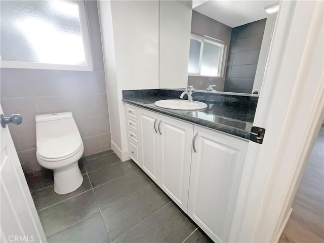 1564 Tanglewood Ln Unit 11, Escondido, CA 92029 - half bath featuring vanity, plenty of natural light, and tile patterned flooring