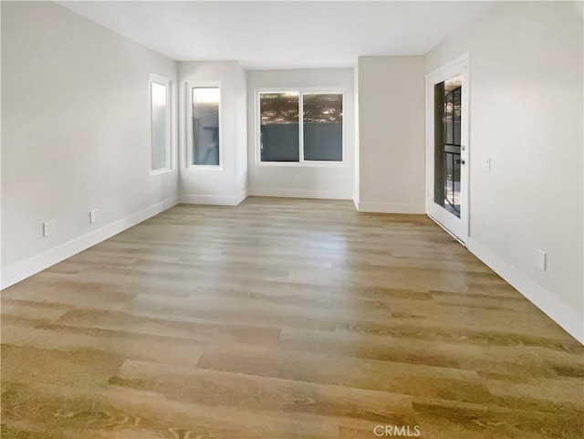 1564 Tanglewood Ln Unit 11, Escondido, CA 92029 - unfurnished room featuring wood finished floors and baseboards