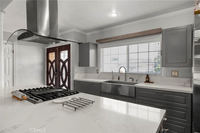 759 S Briargate Ln, Covina, CA 91723 - kitchen featuring island exhaust hood, gray cabinetry, gas cooktop, crown molding, and light stone countertops
