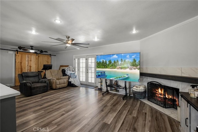 759 S Briargate Ln, Covina, CA 91723 - living room featuring french doors, a tiled fireplace, wood finished floors, ornamental molding, and recessed lighting