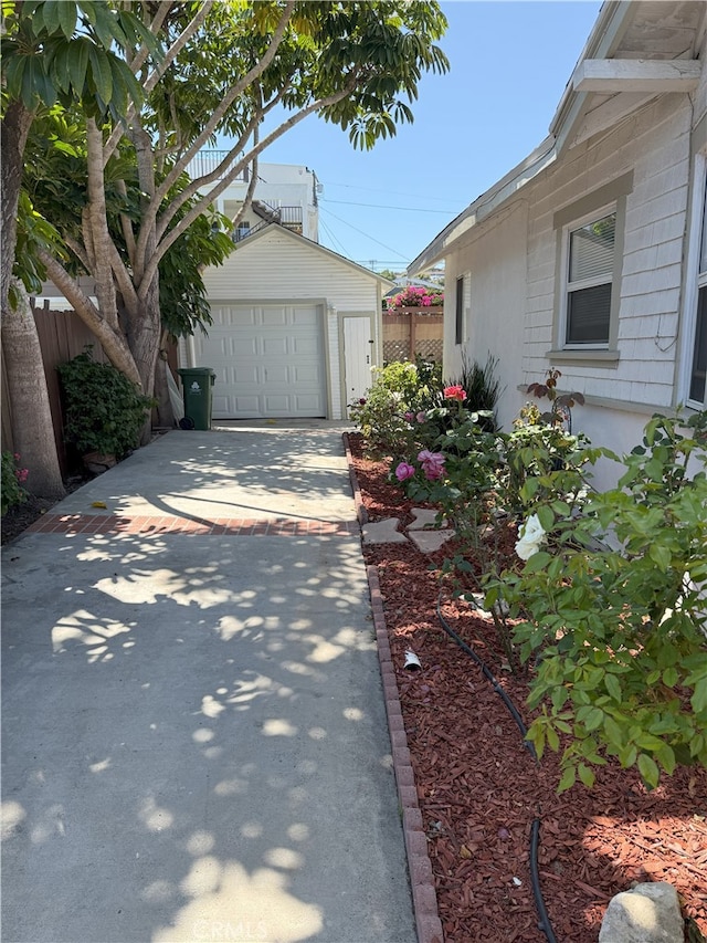 3031 S Denison Ave, San Pedro, CA 90731 - view of home's exterior featuring driveway, an outbuilding, and a detached garage