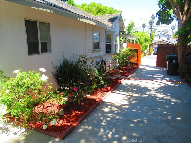 3031 S Denison Ave, San Pedro, CA 90731 - view of property exterior featuring roof with shingles and stucco siding