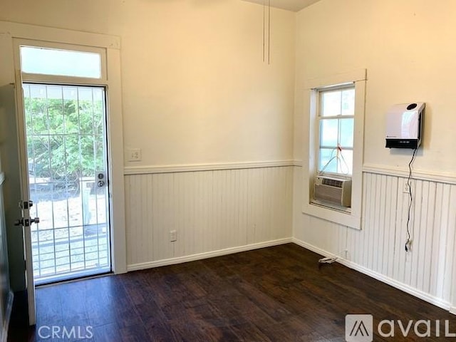 340 E Main St, San Jacinto, CA 92583 - empty room with a wainscoted wall, dark wood-style floors, and cooling unit