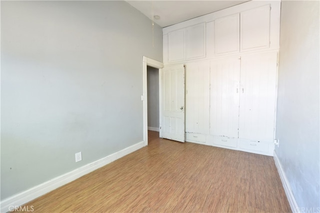 340 E Main St, San Jacinto, CA 92583 - unfurnished bedroom featuring light wood finished floors and a closet