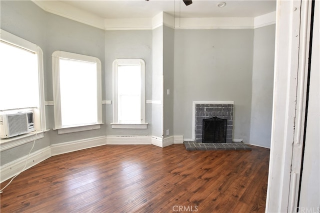 340 E Main St, San Jacinto, CA 92583 - unfurnished living room featuring wood finished floors, a ceiling fan, cooling unit, and a fireplace with raised hearth