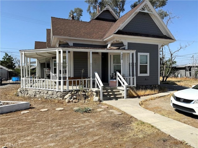 340 E Main St, San Jacinto, CA 92583 - view of front of home featuring a porch and a shingled roof