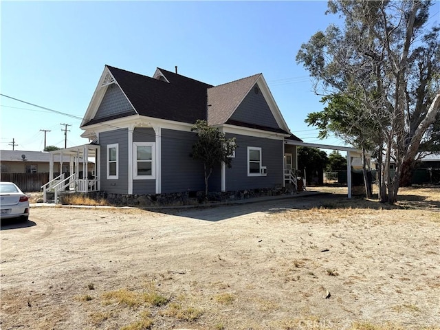340 E Main St, San Jacinto, CA 92583 - view of front of home featuring driveway and roof with shingles