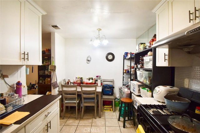 12828 Ramona Blvd Unit 96, Baldwin Park, CA 91706 - kitchen featuring black range with gas stovetop, light tile patterned flooring, a chandelier, ventilation hood, and white cabinets