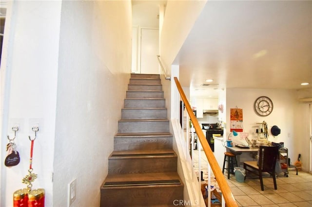 12828 Ramona Blvd Unit 96, Baldwin Park, CA 91706 - stairway featuring tile patterned flooring and recessed lighting