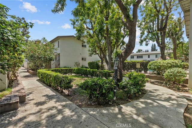 18555 Collins St Unit C30, Tarzana, CA 91356 - view of side of home featuring stucco siding