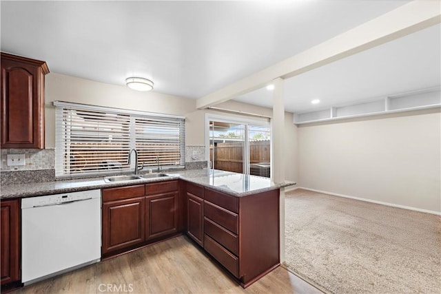 4690 Larwin Ave, Cypress, CA 90630 - kitchen with dishwasher, backsplash, a peninsula, stone countertops, and light wood-type flooring