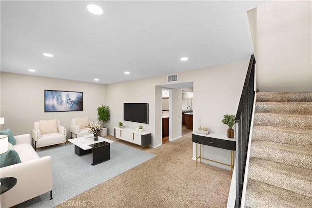 4690 Larwin Ave, Cypress, CA 90630 - living area featuring stairway, light carpet, and recessed lighting