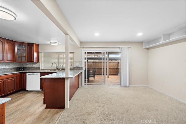 4690 Larwin Ave, Cypress, CA 90630 - kitchen with white dishwasher, a peninsula, glass insert cabinets, backsplash, and recessed lighting