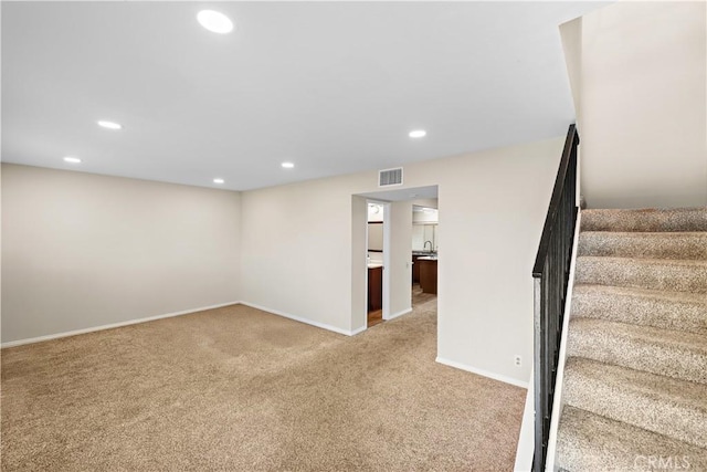 4690 Larwin Ave, Cypress, CA 90630 - basement featuring light carpet, stairway, and recessed lighting