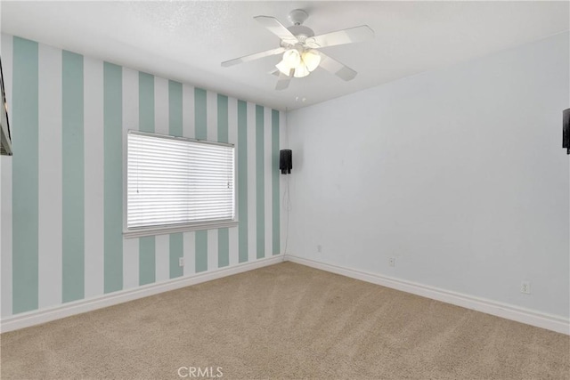 6643 Avenal St, Phelan, CA 92371 - carpeted spare room featuring ceiling fan and baseboards