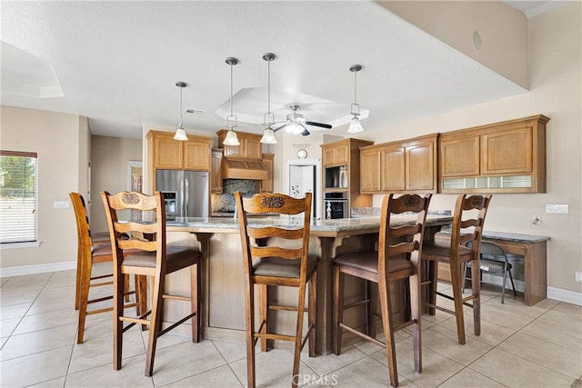6643 Avenal St, Phelan, CA 92371 - kitchen featuring stainless steel appliances, light tile patterned flooring, and a ceiling fan
