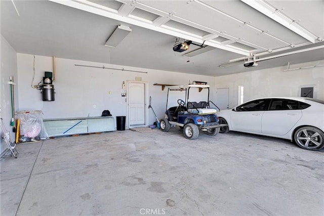 6643 Avenal St, Phelan, CA 92371 - garage featuring a garage door opener