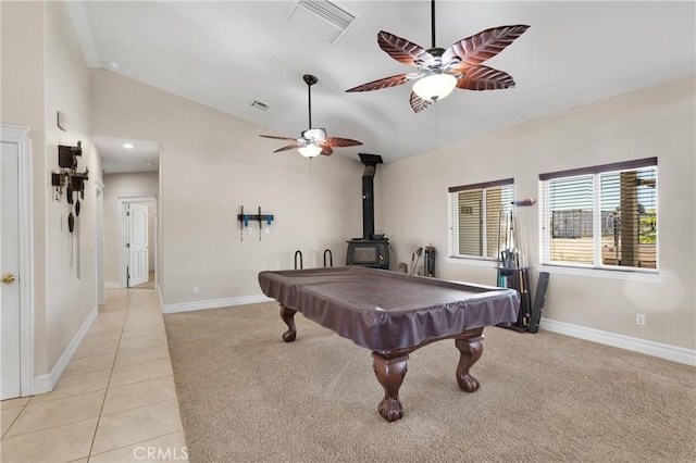 6643 Avenal St, Phelan, CA 92371 - recreation room with vaulted ceiling, ceiling fan, a wood stove, light carpet, and billiards table