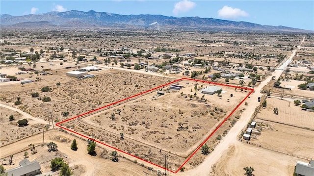 6643 Avenal St, Phelan, CA 92371 - aerial view of sparsely populated area with property parcel outlined and a mountainous background