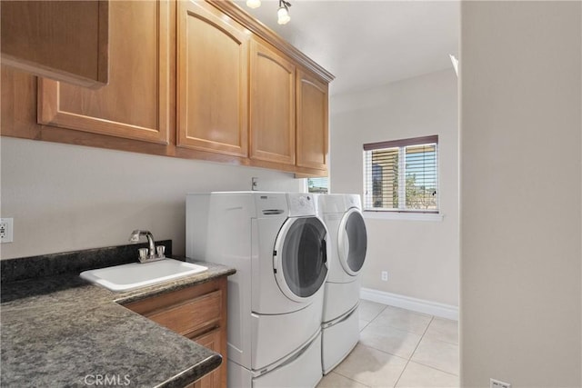 6643 Avenal St, Phelan, CA 92371 - washroom featuring independent washer and dryer, cabinet space, and light tile patterned floors