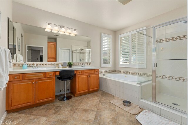 30355 Lamplighter Ln, Menifee, CA 92584 - full bathroom with a shower stall, double vanity, a garden tub, and decorative backsplash